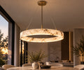 MarbleGlow ronde hanglamp met marmerlook boven een eettafel bij zonsondergang